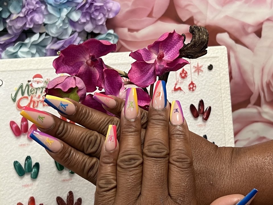 Manicured nails with glossy polish and clean shaping.