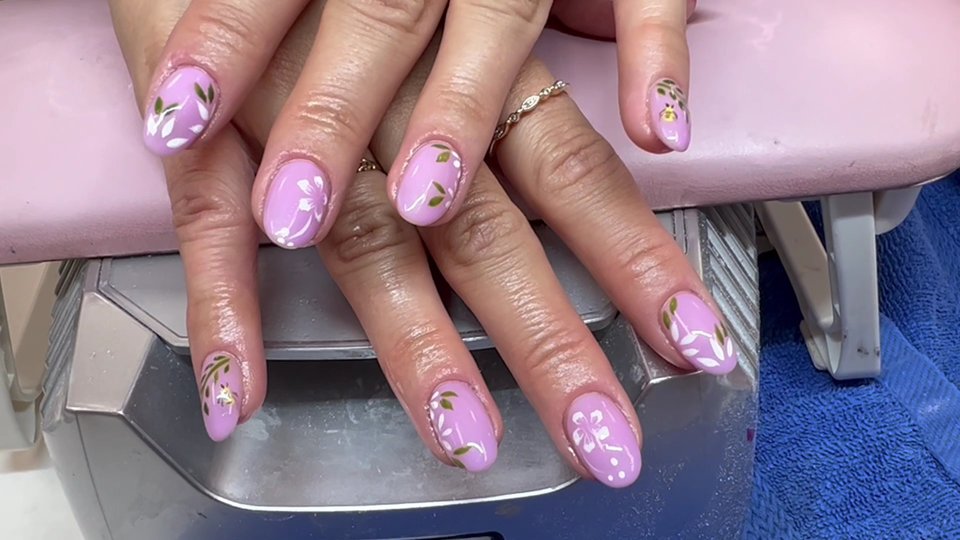 Manicured nails with glossy polish and clean shaping.